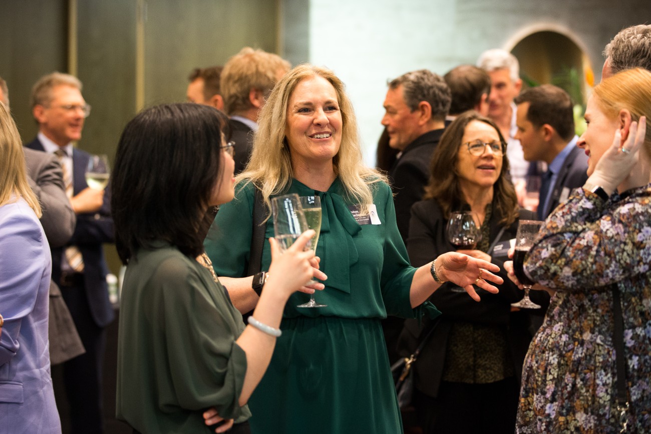 Guests networking and talking with each other during Auckland stakeholder's event