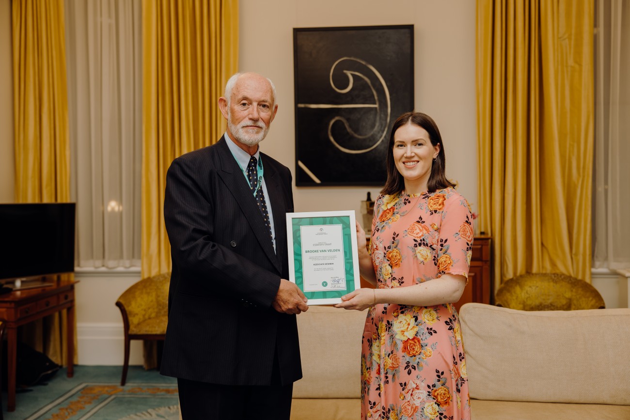 Brooke van Velden receiving award from Peter Griffiths